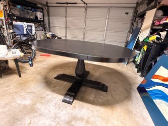 Black oval wood dining room table