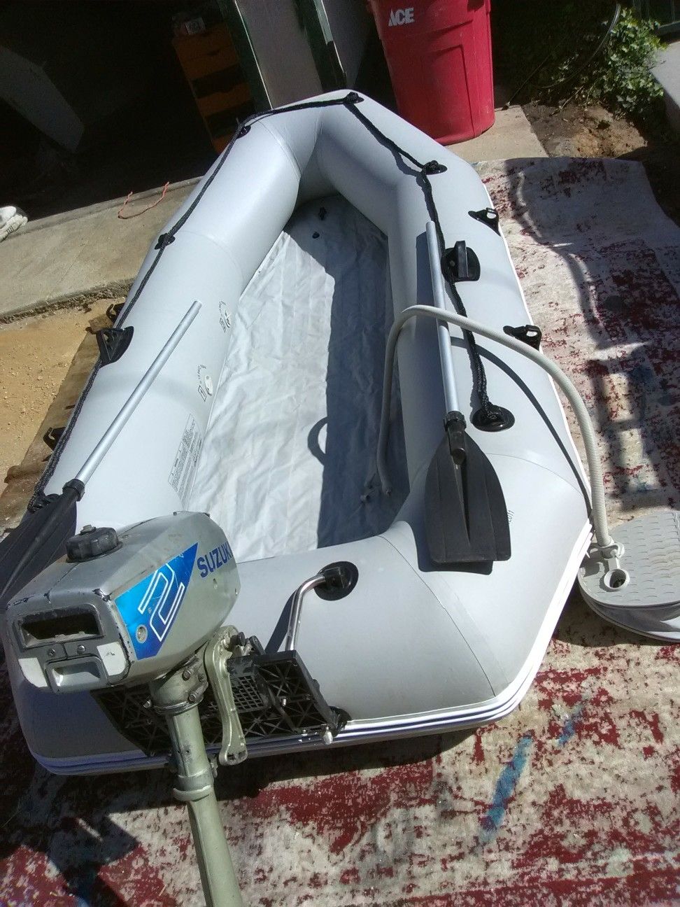 10 ft Solstice inflatable with 2 hp Suzuki outboard