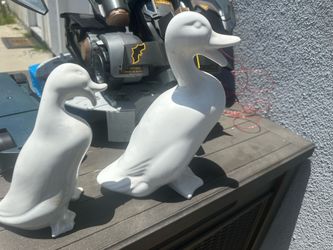 white ceramic duck figurines