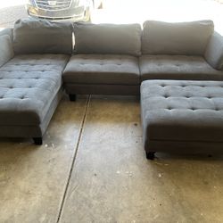 Grey Fabric Couch And Ottoman 