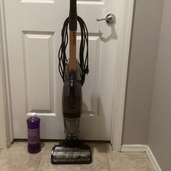 Bissell Crosswave Hydro Steam Hard Floor Cleaner  and An Unopened Bottle Of cleaning  Solution