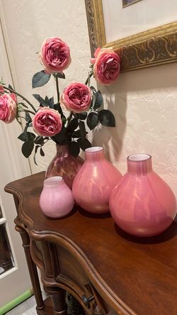 4 pink vases