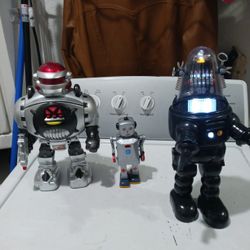3 Vintage Robots.   
1- Pathfinder Robot soldier,  talk, walk and shoot discs.
2- Black Robbie the robot.
3- and the Sparkling Mike robot.  