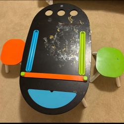 Kids art is table & 2 stools & paper roll