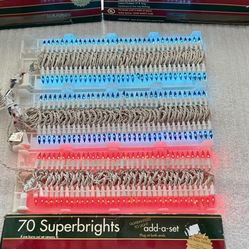 70 Ultimate Superbrights Light Strand Set.  Set of 3! Indoor/Outdoor. 2 Blue and 1 Red Color-White Cord. New in box ! 