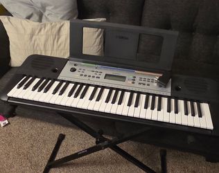 Yamaha keyboard piano with stand