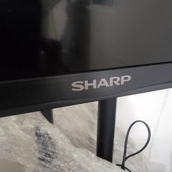 Sharp Tv With Rollable Stand And Tv Controller 