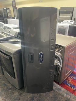 dark gray Ford Super Duty truck tailgate (likely for an F-250 or F-350 model from the 2008–2016
