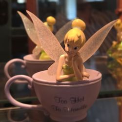 Tinker Bell figurine from a tea-themed collection.