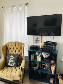 Vintage tufted winged back chair