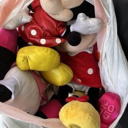 Bag Of Minnie Mouse Plushies And Big Minnie Mouse 