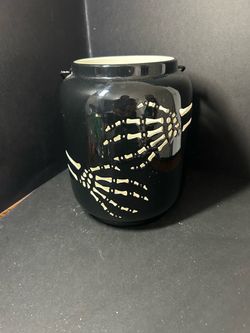 Ceramic skeleton hands candle/light holder