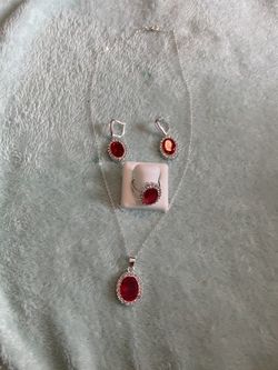 Beautiful set of necklace ring and earrings silver asking 25.00 for the set the ring it’s size 7