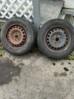 Two used tires with rim