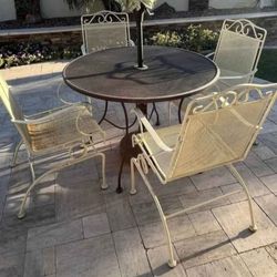 $250  IRON 4 ROCKING CHAIRS AND TABLE