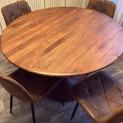 48 Inch round wood Dining Table with four brown chairs