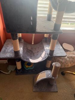 Large cat tree with small scratcher at bottom