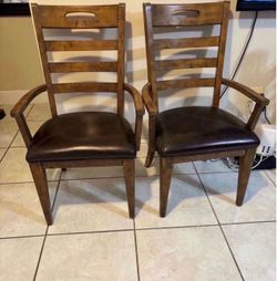 Pair of solid wood arm chairs