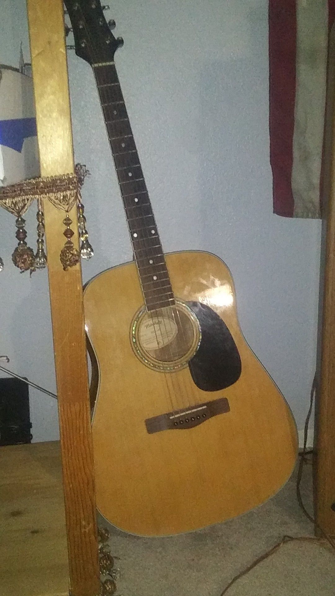 Light brown and black very nice like new mitchell acoustic guitar for sale.