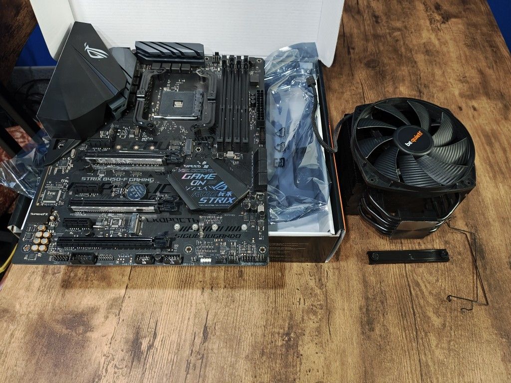 B450 ROG STRIX MOBO with BE QUIET CPU Cooler.
