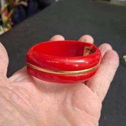Sarah Coventry Vintage Style Red Hinged Clamper Bangle Bracelet Featuring A Distinctive Goldtone Stripe Inlay, Polished Acrylic Or Lucite 70's To 80's
