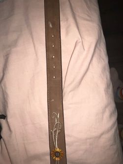 Brown belt w/ flowers on it