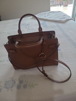 Michael  Kots beautiful. Brown purse a
