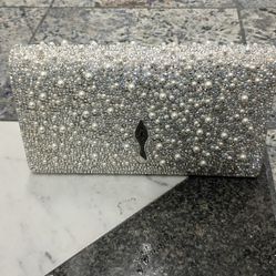 CHRISTIAN LOUBOUTIN Bettina embellished metallic leather clutch