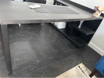 Black L shaped executive desk