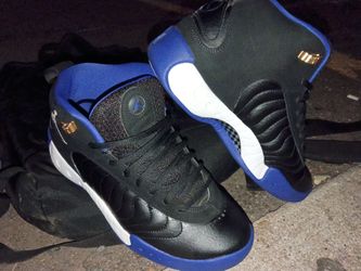 black and royal blue Air Jordan Jumpman Pro sneakers with metallic gold accents