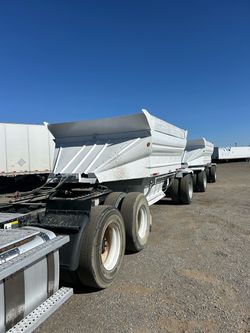 Bottom dump trailers