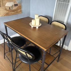 Dining table with four chairs and wine rack