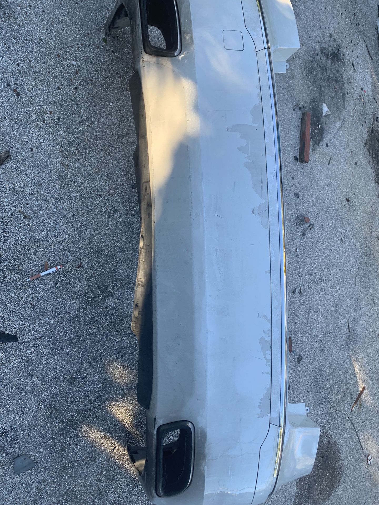 REAR BUMPER FOR A 2013 HYUNDAI GENESIS COMPLETE WITH BRACKETS AND MUFFLER HEAT SHIELDS