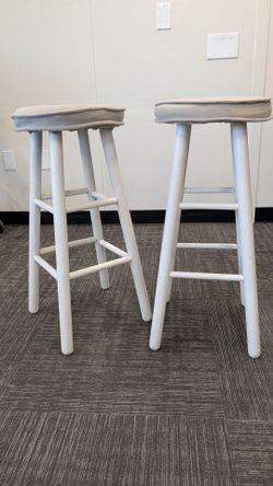 White stools with light gray top