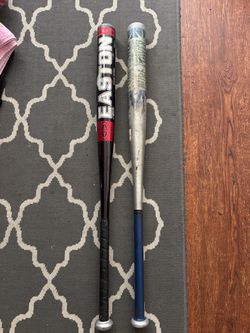 Pair of Easton softball bats