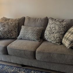 Grey Couch With Decorative Cushions