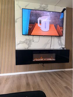 📺 65” TV with floating entertainment center and electric fireplace