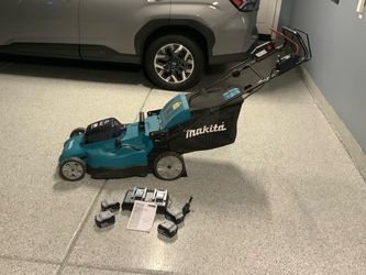 Makita Cordless Lawn Mower in new condition.