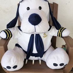 Snoopy dressed as a Sailor.