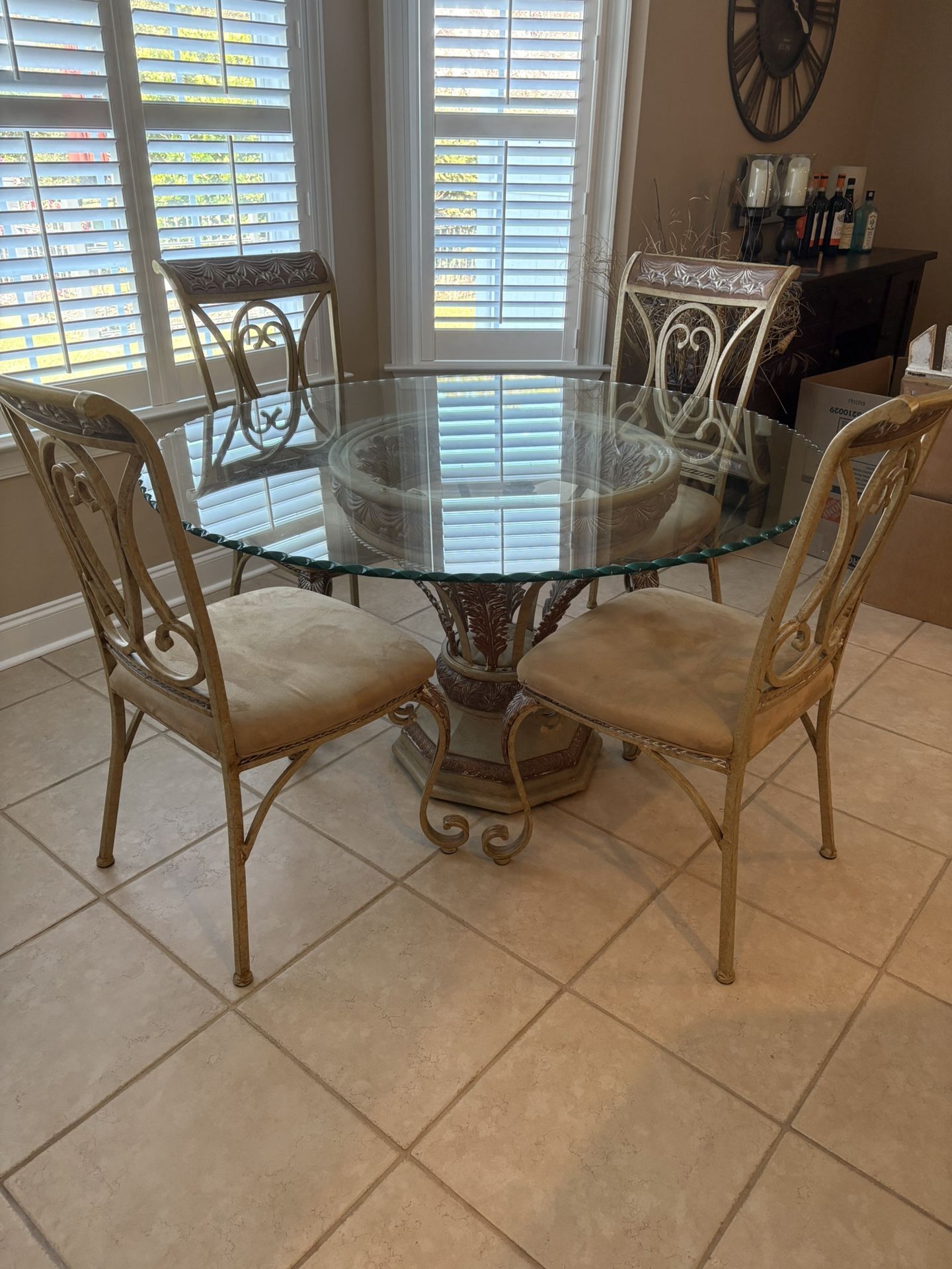 Gorgeous Wrought Iron Very Solid Dining Set. 54” round 30” height. Great condition glass top & 4 Chairs