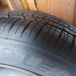 Barely Used 14in Tire And Rim 