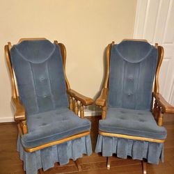 Oak rocking chair with blue upholstery, designed to provide comfort and support.