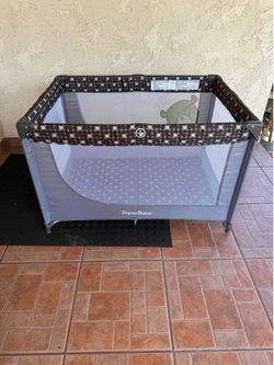 baby crib or portable crib with mattress.