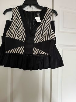 There is A Two Pieces A top and short skirt the skirt size is 7 and the top is S Both for $15 total
