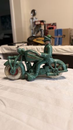 These are all steel and iron banks there’s an old steel clock that works motorcycle