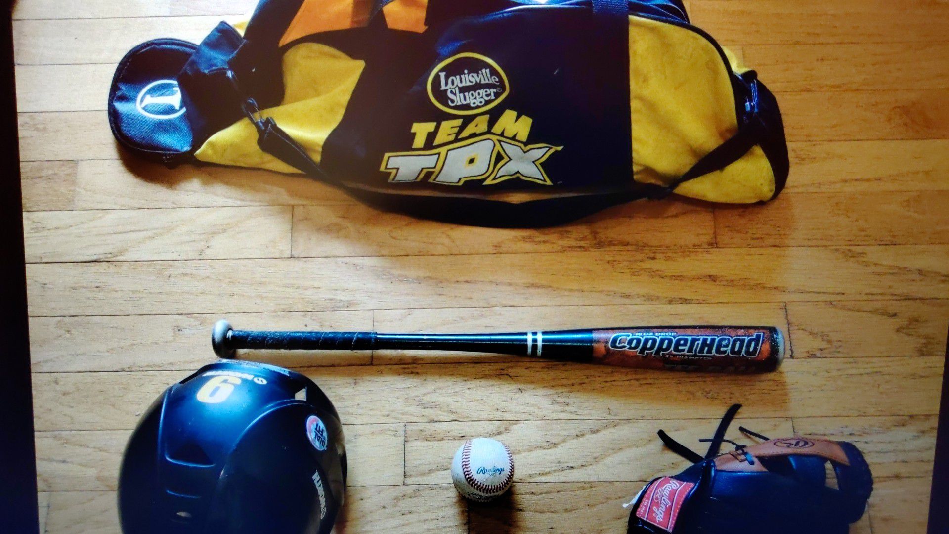 Set of baseball glove bat ball helmet and bag