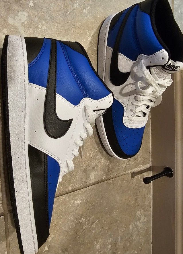 Nike mid top mens shoes. Brand new. Blue, black and white. Size 12.