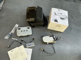 DJI Mini 2 Aerial Camera Bundle - Drone charged and flown up in the air once. Then stored and unused.