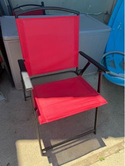 8 red fold up chairs