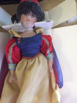 Snow White porcelain doll has stand